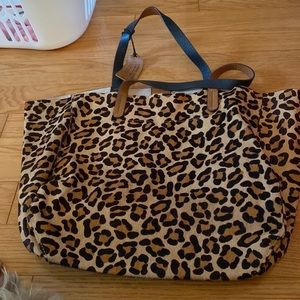 Big genuine leather very cool leopard print bag!  Unlined stunning print!